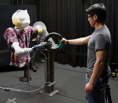 Fast Handovers with a Robot Character: Small Sensorimotor Delays Improve Perceived Qualities